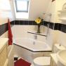 Bathroom with corner bath, © bed and pool Bathroom with corner bath, © bed and pool