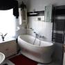 Bathroom with bath, © bed and pool Bathroom with bath, © bed and pool