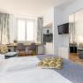 Hotel Zentral Doppelzimmer, © MartinHaider Fotografie/Hotel Zentral Schwartz GmbH Modernes Hotelzimmer mit Doppelbett, Schreibtisch, Stühlen und TV.